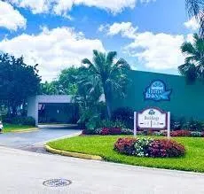 a sign that is sitting in front of a house