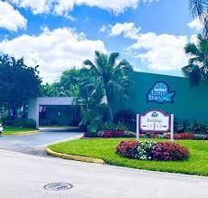 9301 Lime Bay Boulevard, Unit 204 Tamarac, FL 33321 - Photo 12 of 30 a sign that is sitting in front of a house