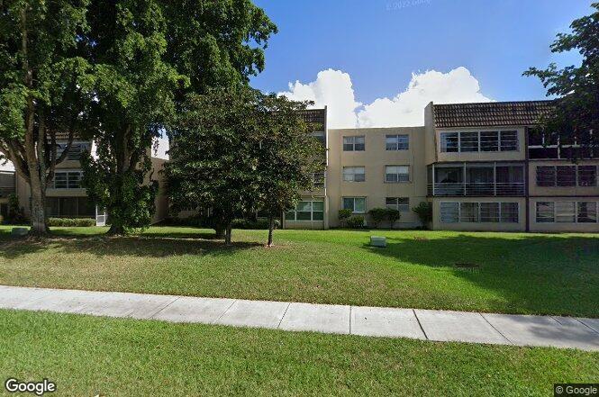 9301 Lime Bay Boulevard, Unit 204 Tamarac, FL 33321 - Photo 5 of 30 a view of a house with a yard