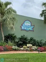 a view of a water with a table and chairs in patio