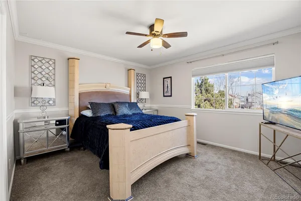 a bed room with a bed and a chair