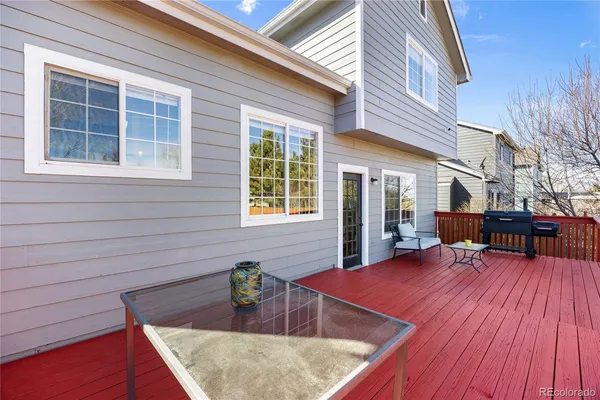 a view of a house with chairs and wooden floor