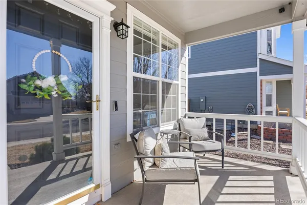a view of balcony with chairs and potted plant
