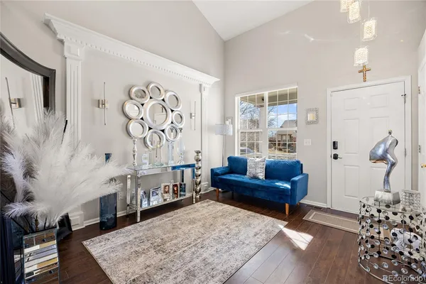 a living room with furniture and a rug