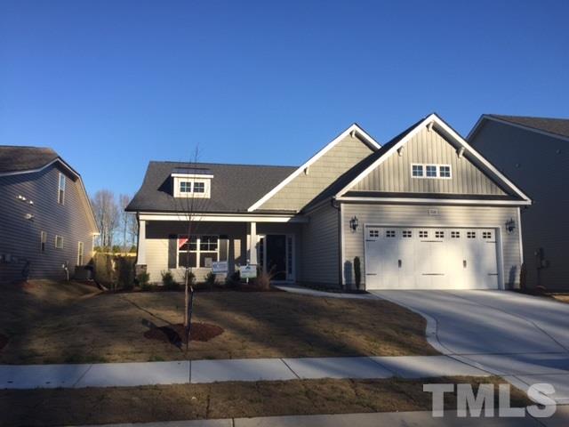 2016 Temple Hills Way Fuquay-Varina, NC 27526 - Photo 1 of 13 a front view of a house with a yard