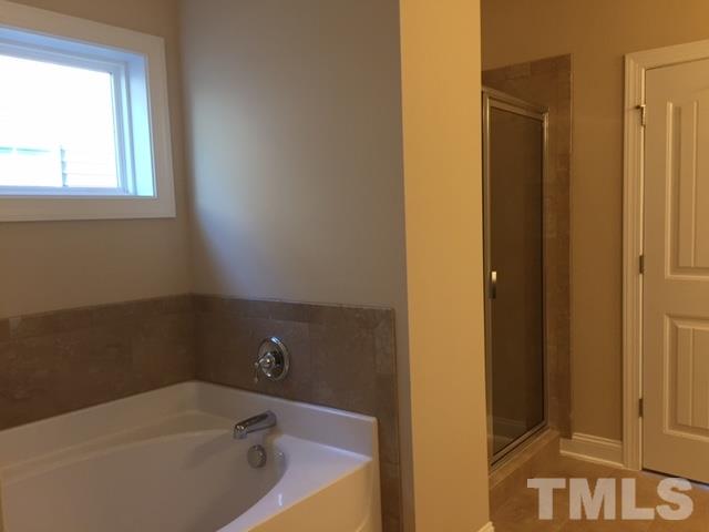 2016 Temple Hills Way Fuquay-Varina, NC 27526 - Photo 12 of 13 a bathroom with a bathtub