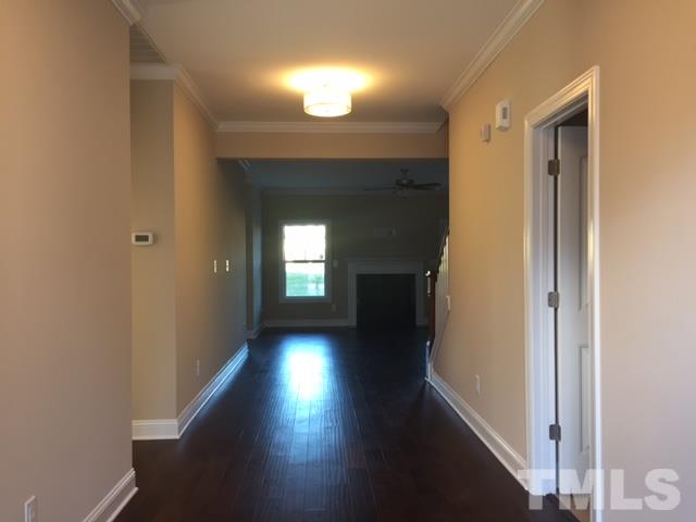 2016 Temple Hills Way Fuquay-Varina, NC 27526 - Photo 4 of 13 a view of hallway with wooden floor