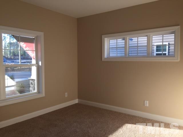 2016 Temple Hills Way Fuquay-Varina, NC 27526 - Photo 5 of 13 a view of an empty room with a window