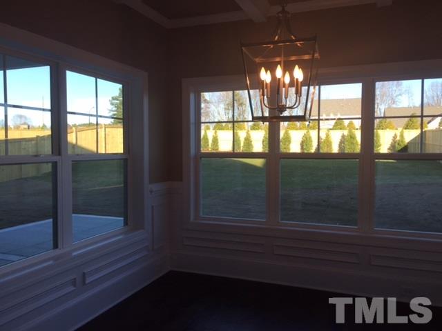 2016 Temple Hills Way Fuquay-Varina, NC 27526 - Photo 6 of 13 a view of empty room with wooden floor and fan