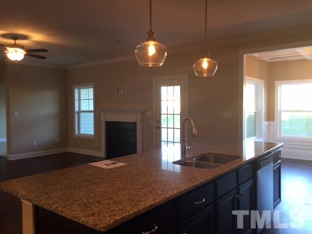 2016 Temple Hills Way Fuquay-Varina, NC 27526 - Photo 8 of 13 a kitchen with kitchen island granite countertop sink and window