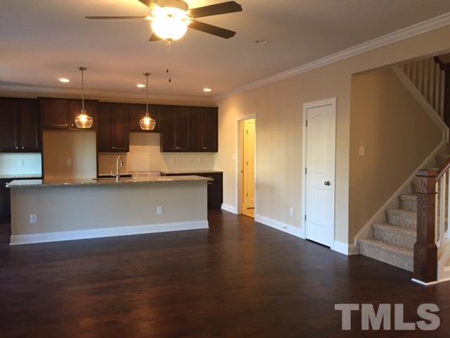 2016 Temple Hills Way Fuquay-Varina, NC 27526 - Photo 9 of 13 a view of a kitchen with a sink and a refrigerator