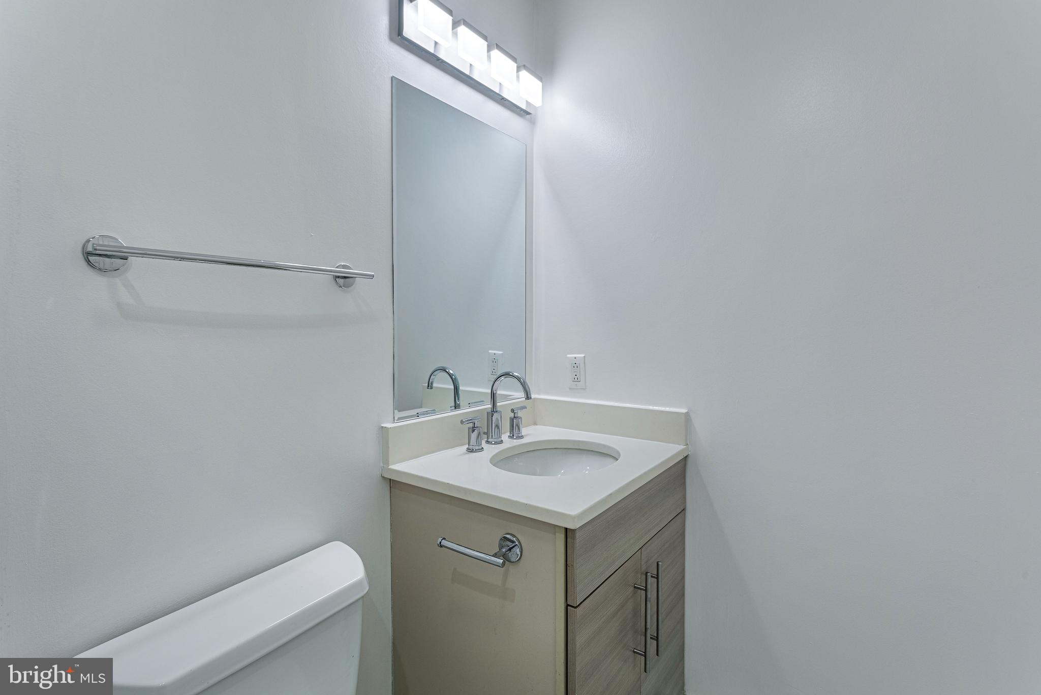 1219 K Street Northeast, Unit 202 Washington, DC 20002 - Photo 9 of 15 a bathroom with a sink and a toilet