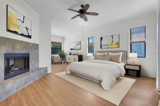 a spacious bedroom with a bed and a fireplace