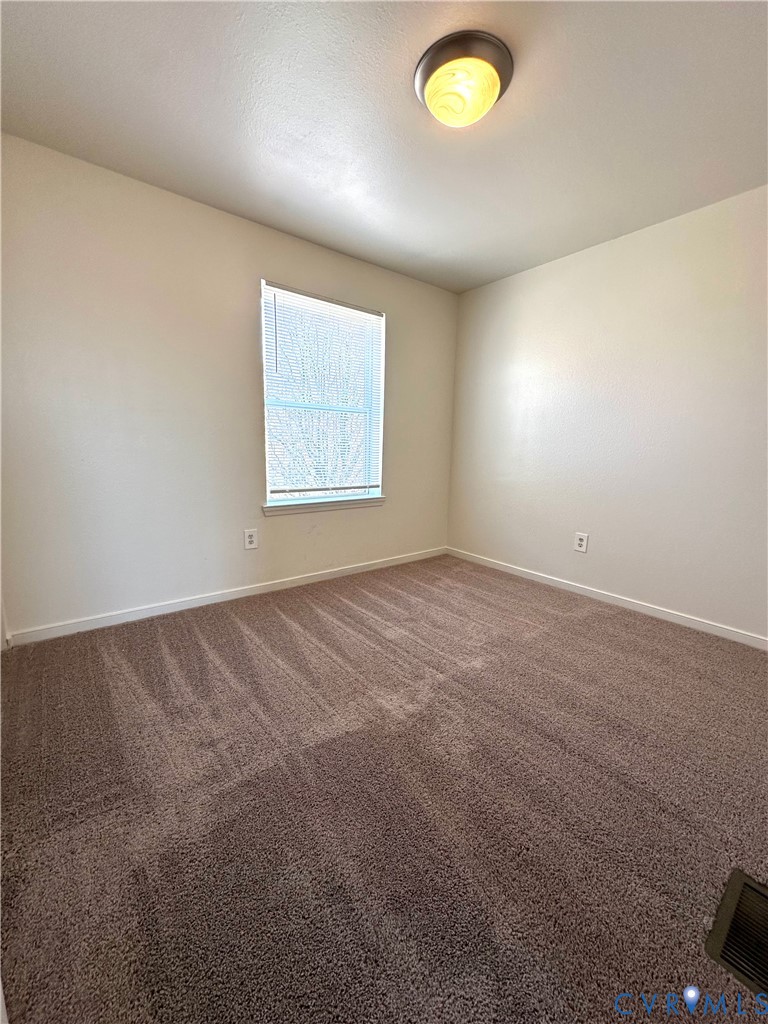 3510 East Richmond Road, Unit U12 Richmond, VA 23223 - Photo 13 of 26 an empty room with a window