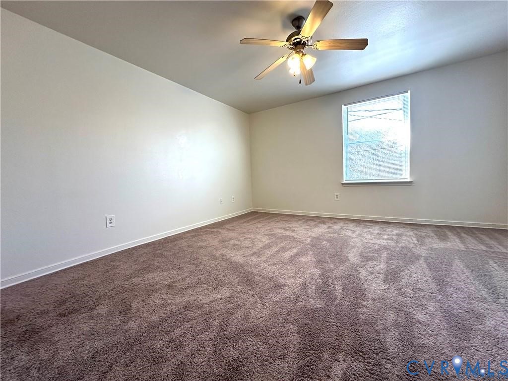 3510 East Richmond Road, Unit U12 Richmond, VA 23223 - Photo 22 of 26 an empty room with a window and a ceiling fan