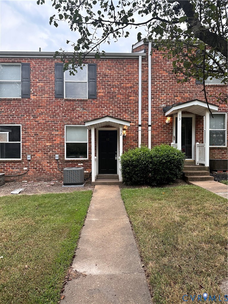 3510 East Richmond Road, Unit U12 Richmond, VA 23223 - Photo 25 of 26 a front view of a house with yard and green space