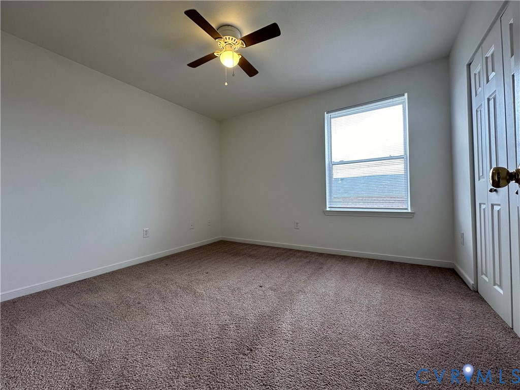 3510 East Richmond Road, Unit U12 Richmond, VA 23223 - Photo 6 of 26 an empty room with a window and a fan
