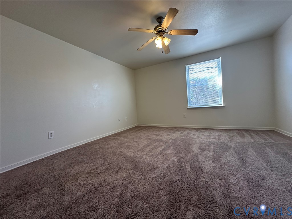3510 East Richmond Road, Unit U12 Richmond, VA 23223 - Photo 10 of 26 an empty room with windows and fan