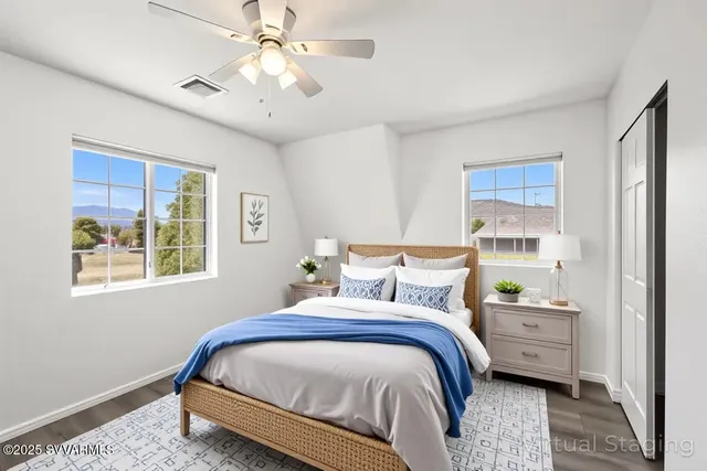 a bedroom with bed and a window