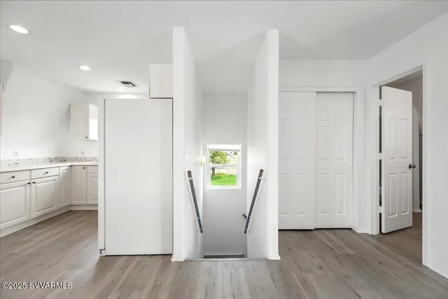 a view of kitchen with a white stove top oven and sink