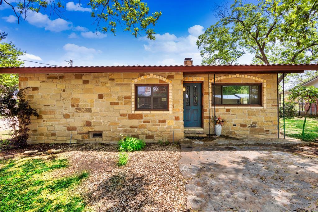805 Wheeler Street Mason, TX 76856 - Photo 2 of 3 a front view of a house with a yard
