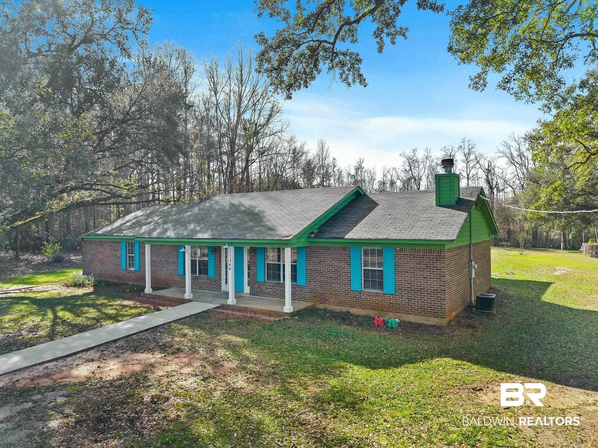 17366 Old Brady Road Bay Minette, AL 36507 - Photo 37 of 43 Ranch-style home featuring a front lawn, brick siding, covered porch, a chimney, and a shingled roof