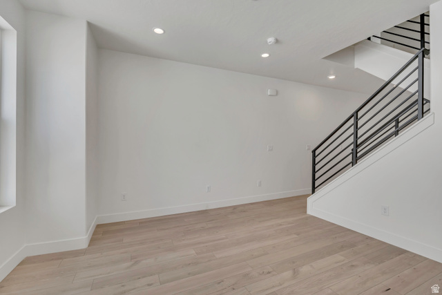 10999 South Freestone Road, Unit 111 South Jordan, UT 84009 - Photo 5 of 13 Empty room with light wood-style floors and recessed lighting