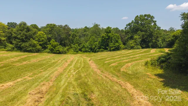 a view of a swimming pool with an outdoor space and seating area