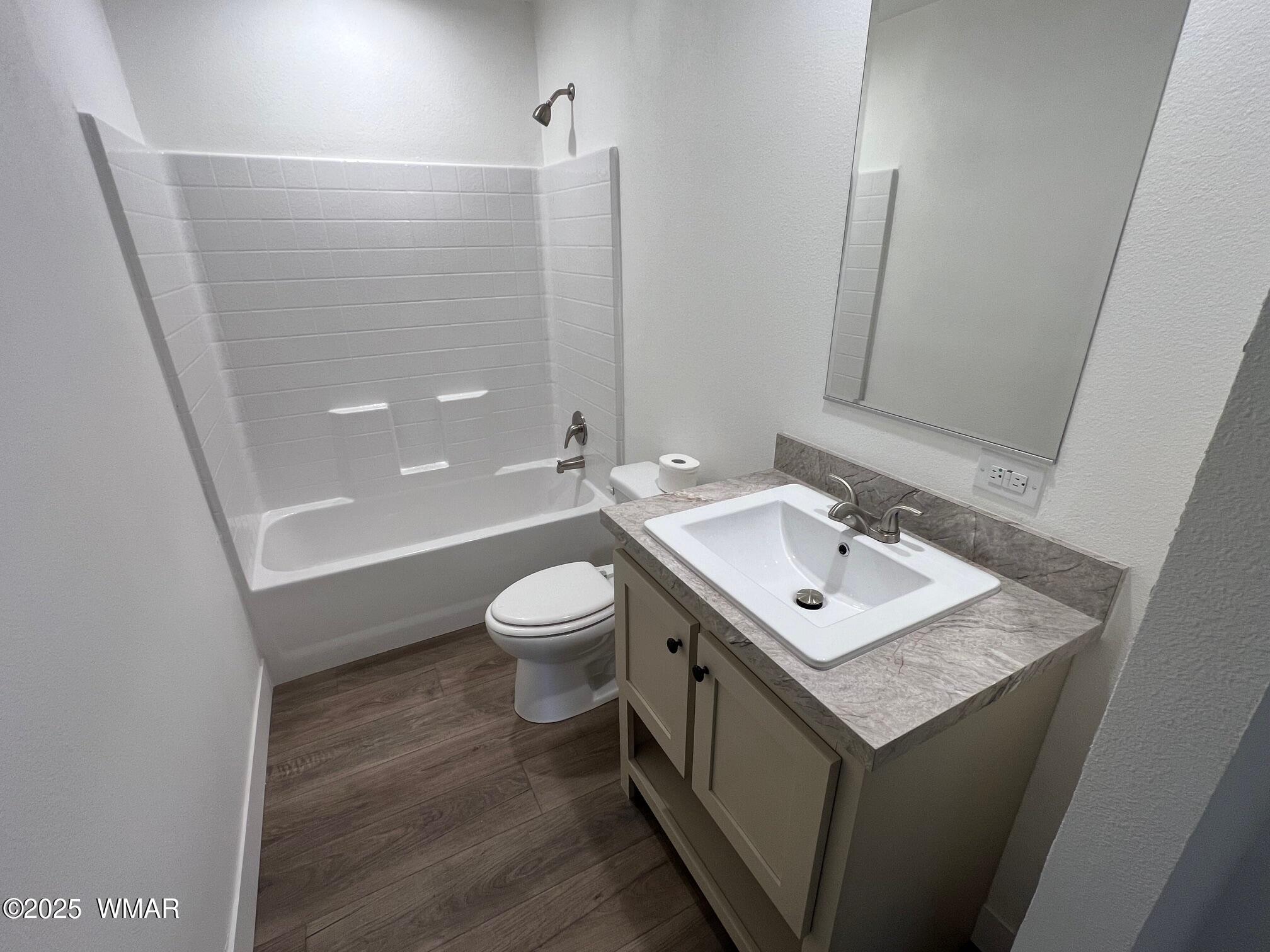 4129 Apache Road Snowflake, AZ 85937 - Photo 18 of 48 a bathroom with a sink a toilet a mirror and shower