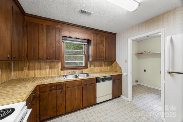 a kitchen with a sink and cabinets