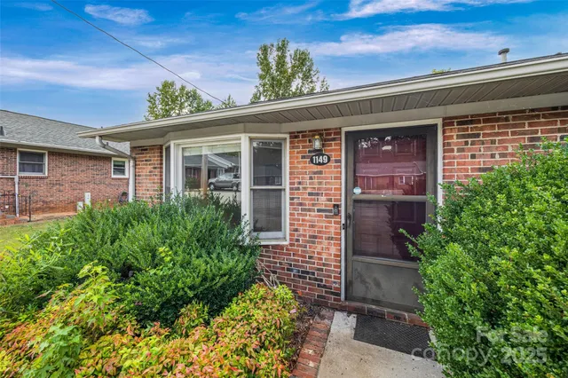 front view of a house with a small yard