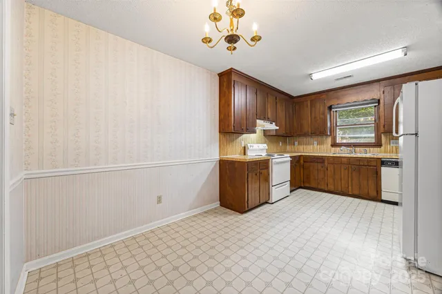 a kitchen with a cabinets and window