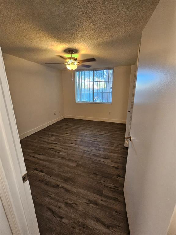 12118 St Andrews Place, Unit 108 Miramar, FL 33025 - Photo 13 of 15 wooden floor in an empty room with a window