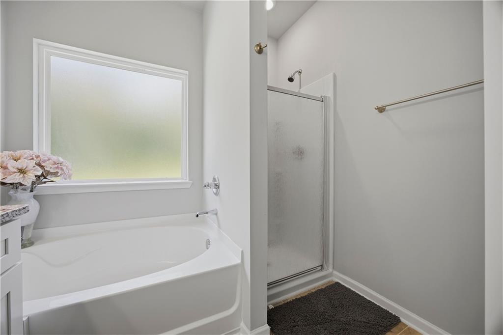 70 Gold Mine Road Grantville, GA 30220 - Photo 14 of 23 a white bath tub sitting next to a shower