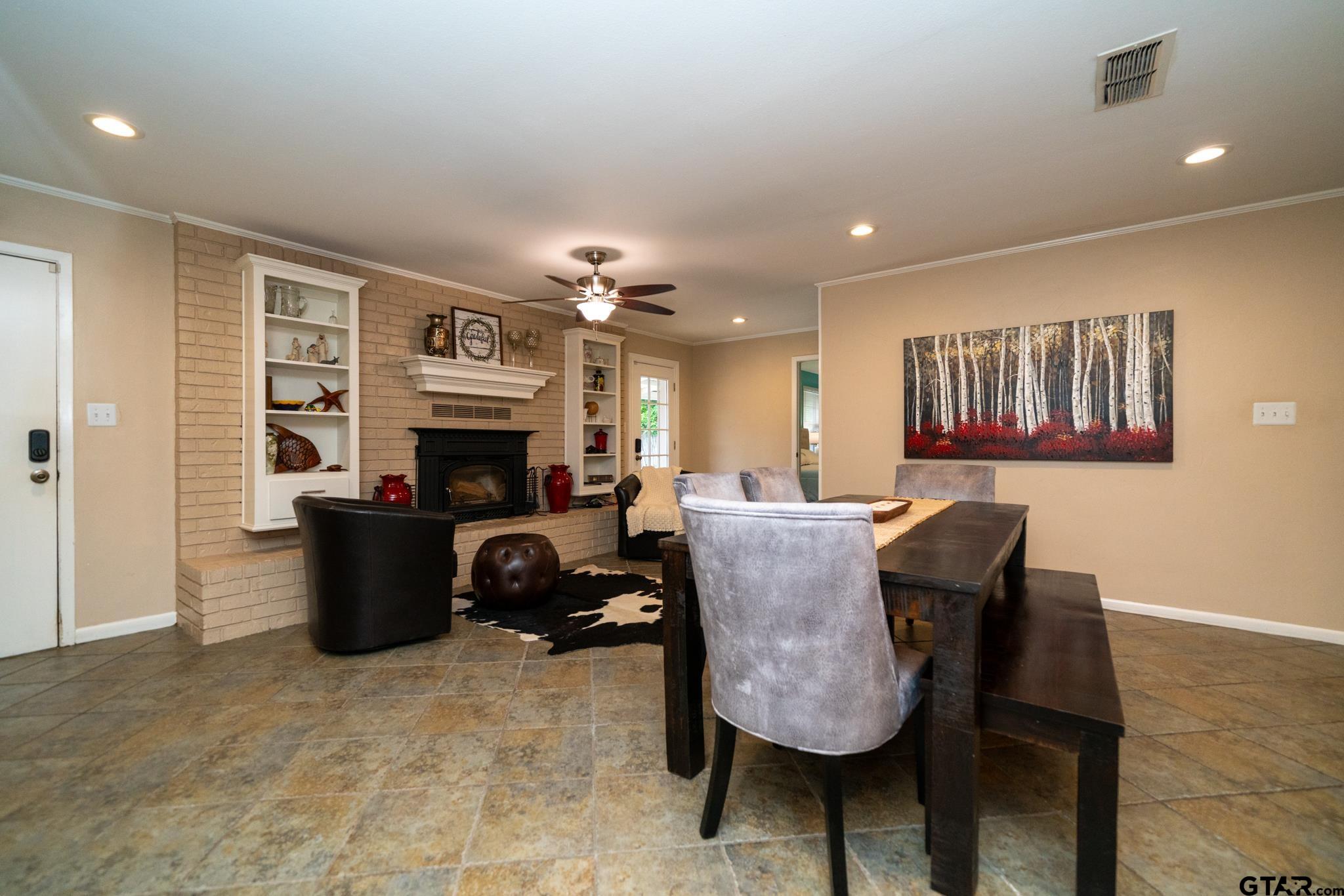102 Randal Lane Pittsburg, TX 75686 - Photo 27 of 42 a living room with furniture and a fireplace