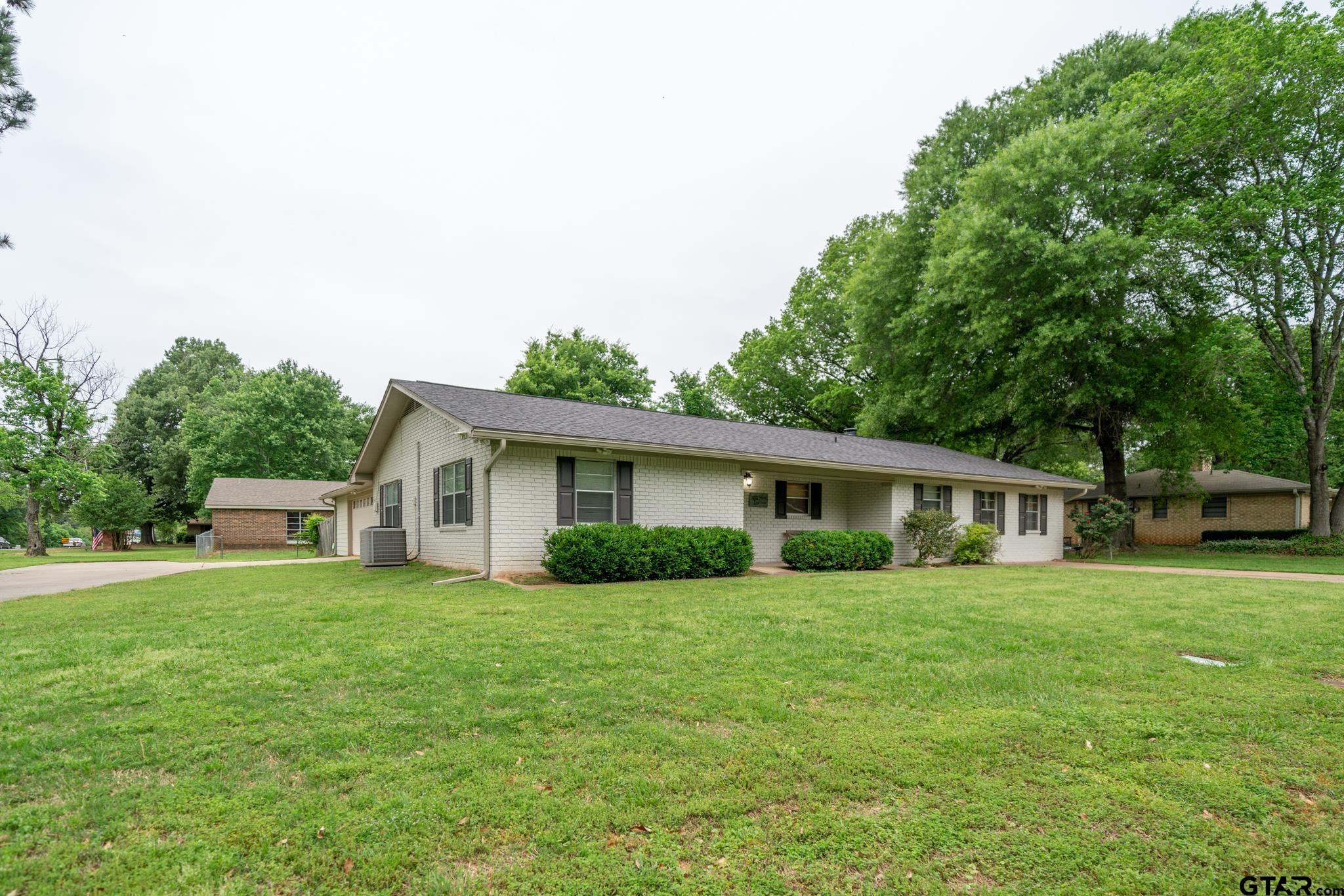 102 Randal Lane Pittsburg, TX 75686 - Photo 3 of 42 a view of a house with a yard and sitting area