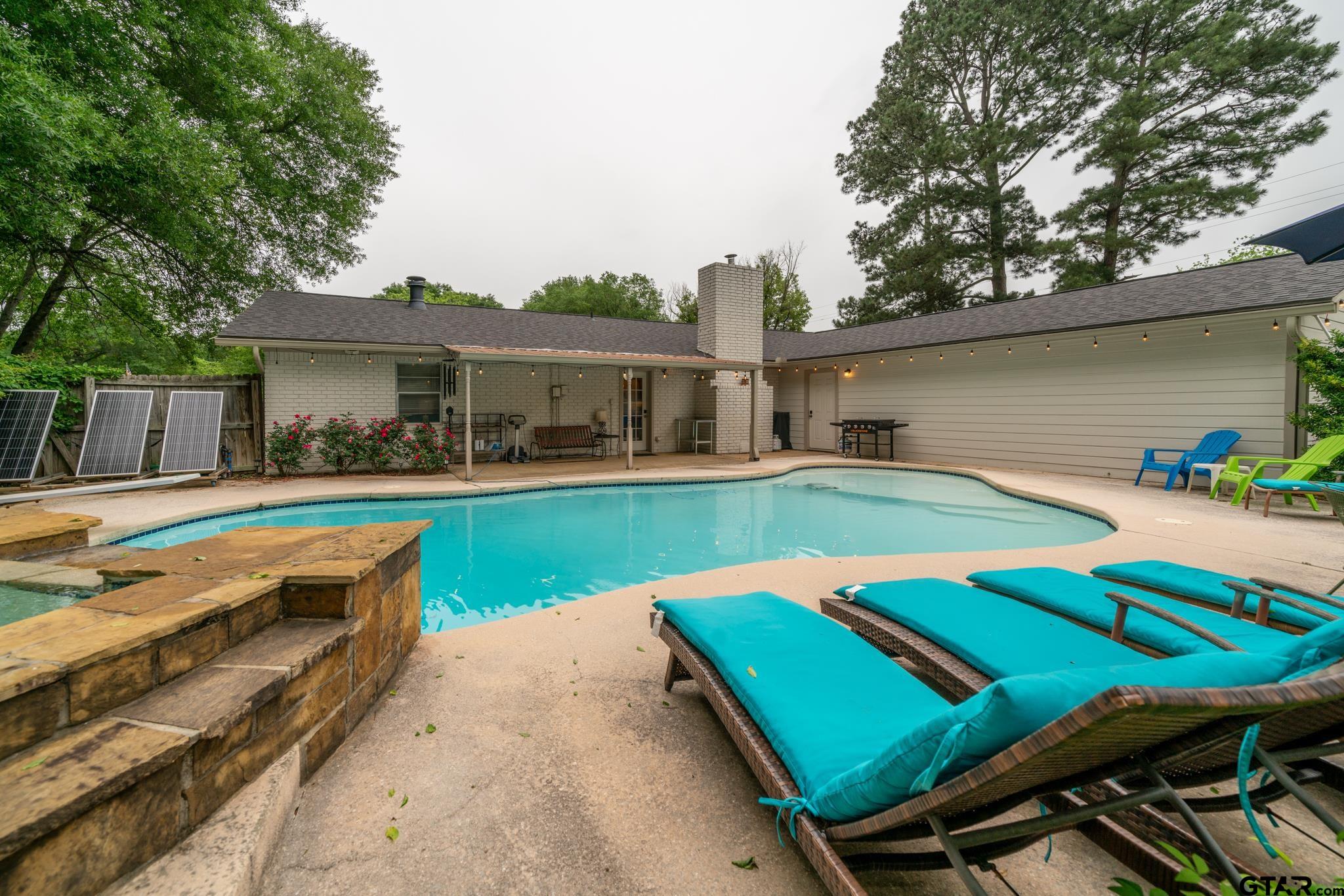 102 Randal Lane Pittsburg, TX 75686 - Photo 37 of 42 a view of a house with a swimming pool and sitting area