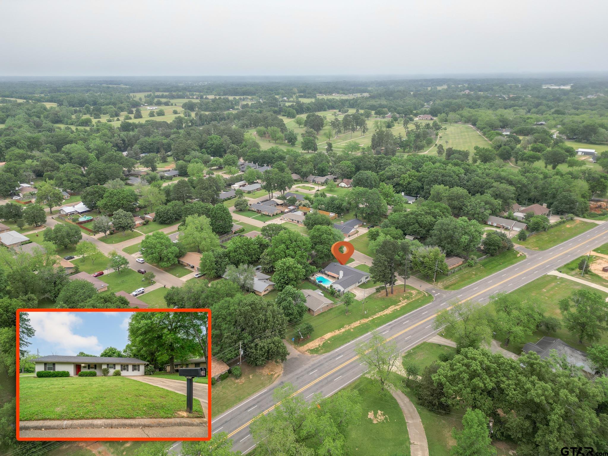 102 Randal Lane Pittsburg, TX 75686 - Photo 7 of 42 an aerial view of residential houses with outdoor space and trees