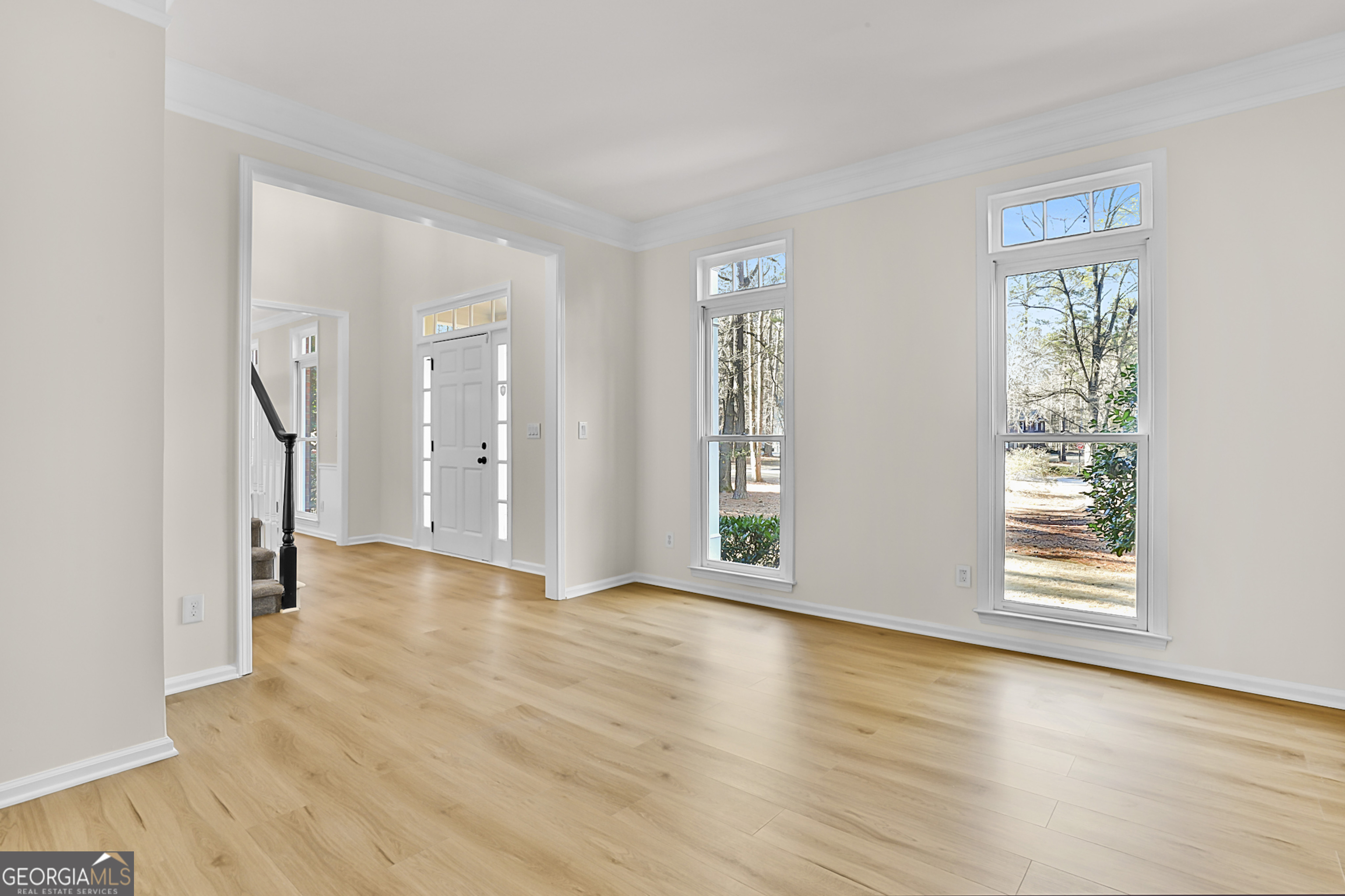 160 Streamview Court Fayetteville, GA 30215 - Photo 12 of 55 a view of an empty room with wooden floor and a window