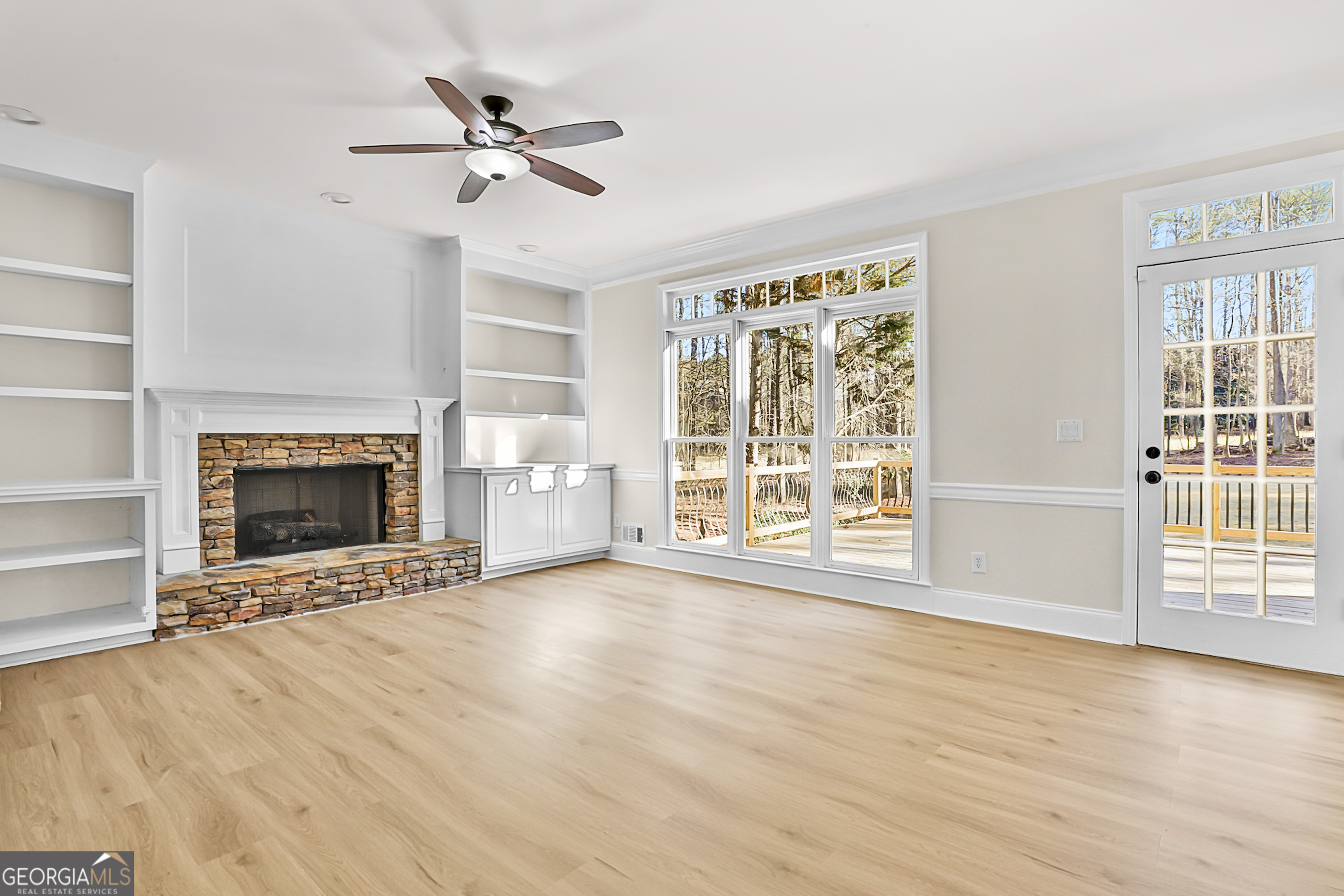 160 Streamview Court Fayetteville, GA 30215 - Photo 17 of 55 a view of an empty room with a fireplace and a window