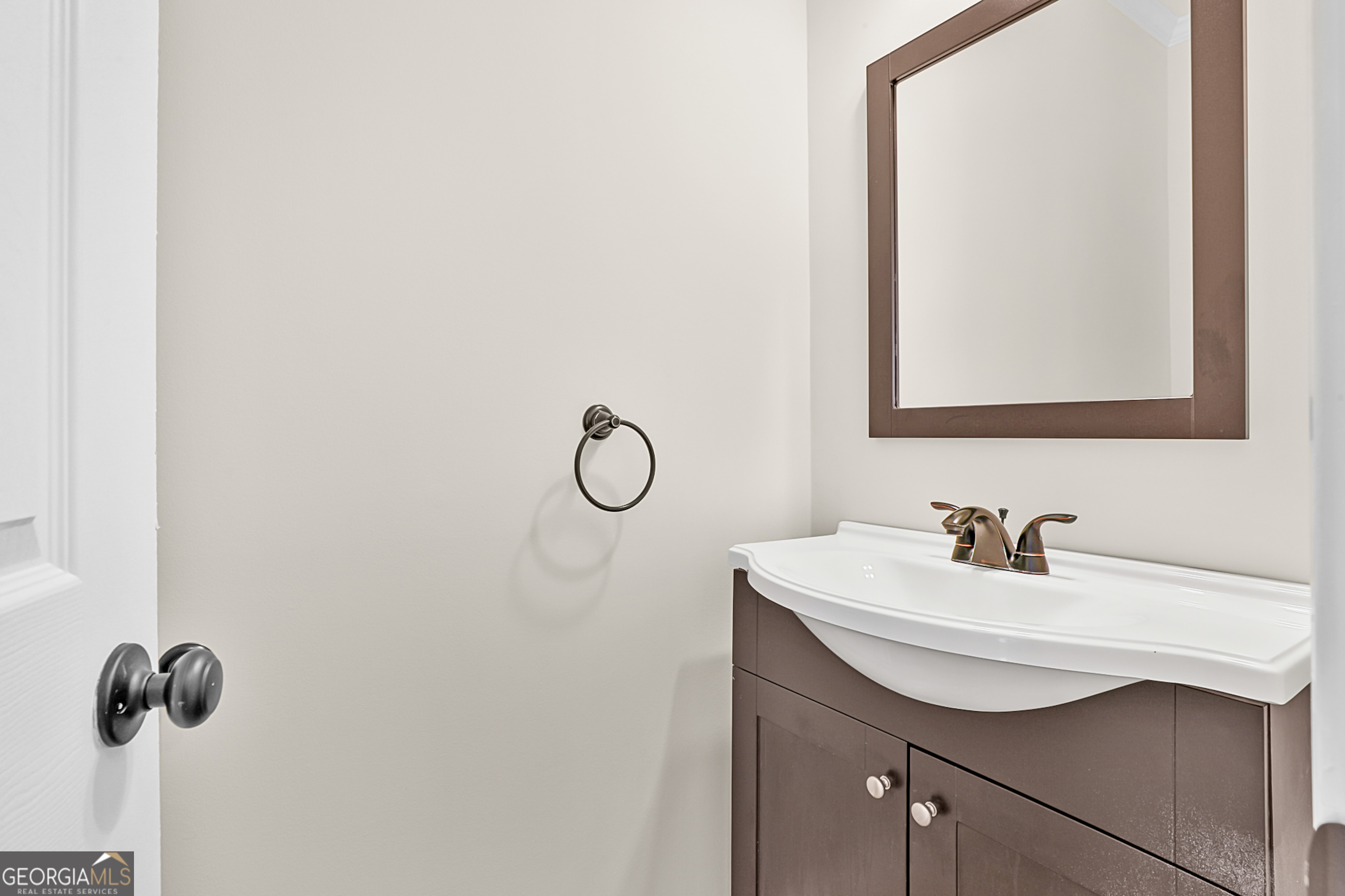 160 Streamview Court Fayetteville, GA 30215 - Photo 31 of 55 a bathroom with a sink and a mirror