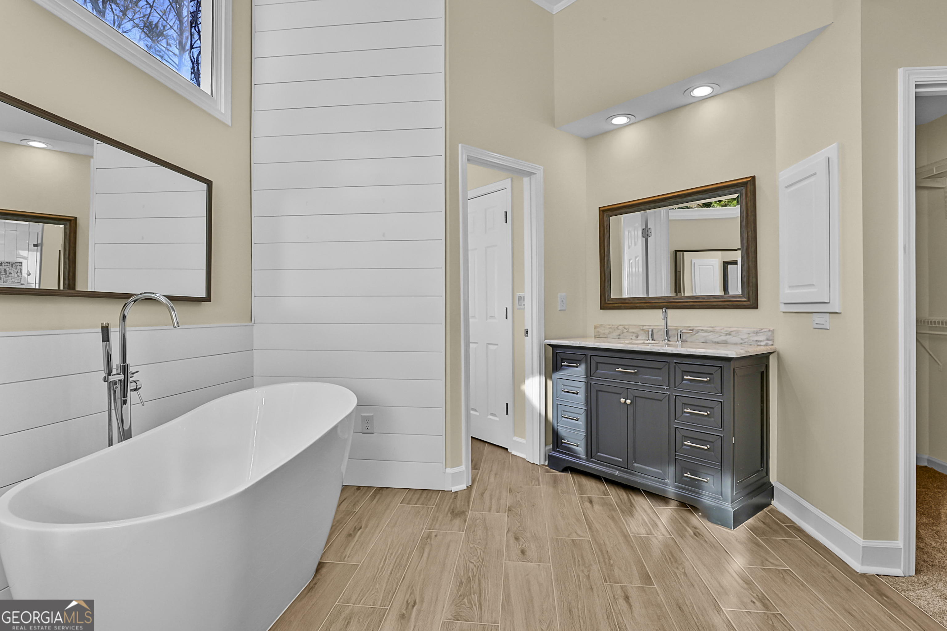 160 Streamview Court Fayetteville, GA 30215 - Photo 37 of 55 a spacious bathroom with a double vanity sink a mirror and bathtub