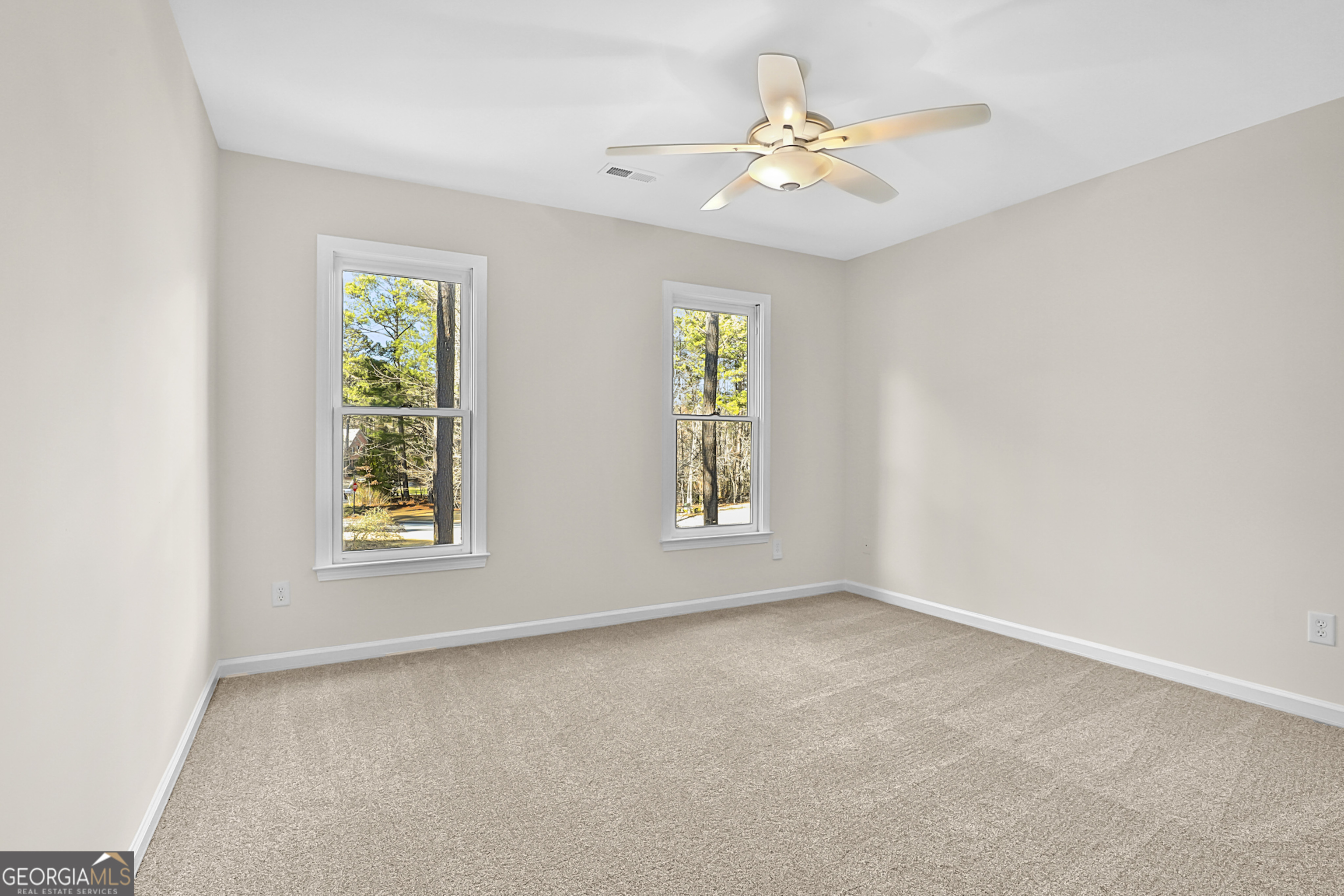 160 Streamview Court Fayetteville, GA 30215 - Photo 43 of 55 an empty room with windows and fan