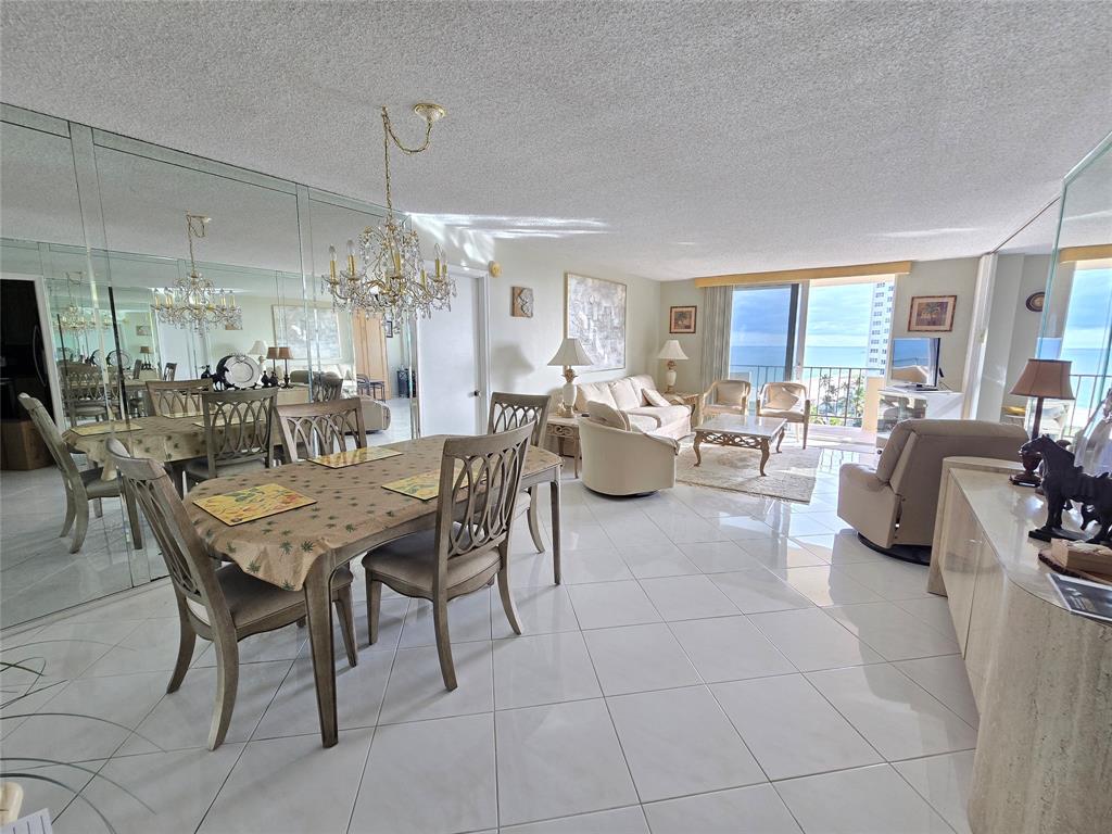 2000 South Ocean Boulevard, Unit 8F Lauderdale-by-the-Sea, FL 33062 - Photo 16 of 35 a view of a dining room with furniture and chandelier