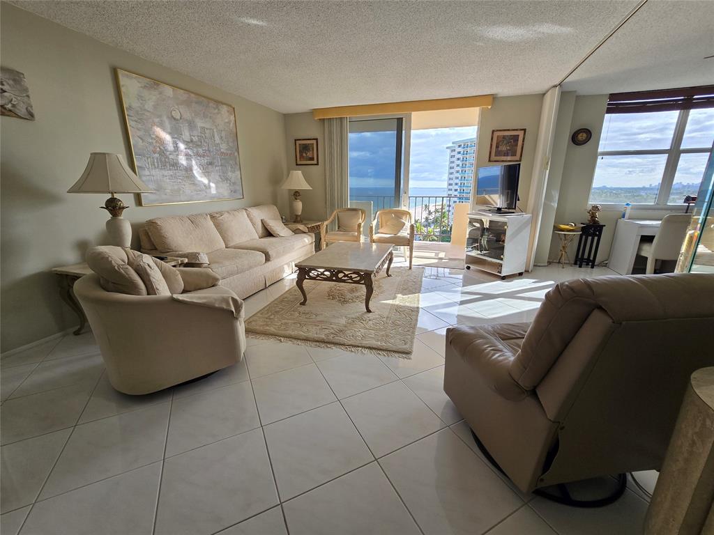 2000 South Ocean Boulevard, Unit 8F Lauderdale-by-the-Sea, FL 33062 - Photo 17 of 35 a living room with couches and large windows