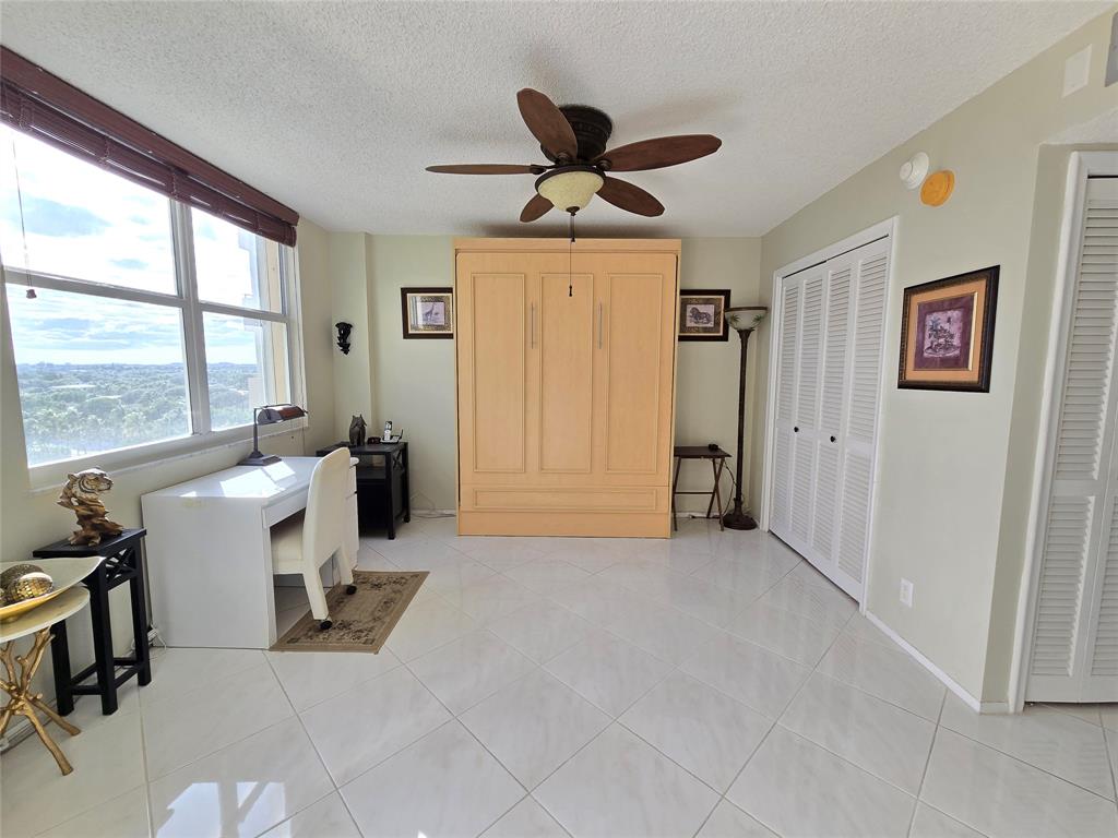 2000 South Ocean Boulevard, Unit 8F Lauderdale-by-the-Sea, FL 33062 - Photo 24 of 35 a view of a livingroom with workspace and a window