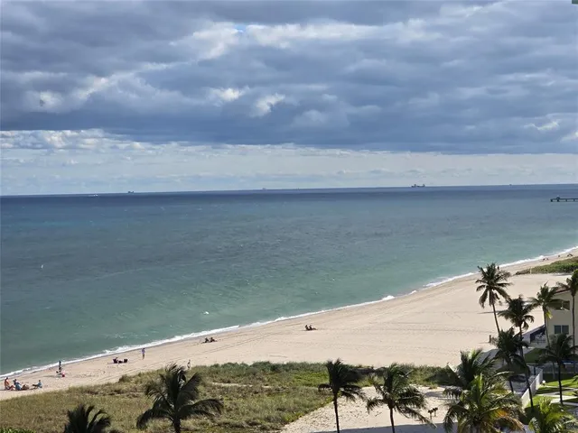 a view of a swimming pool and a yard