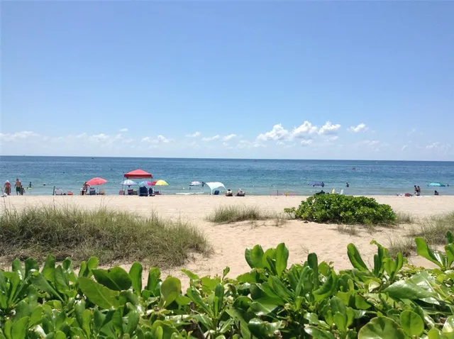 a living room with couch and large window