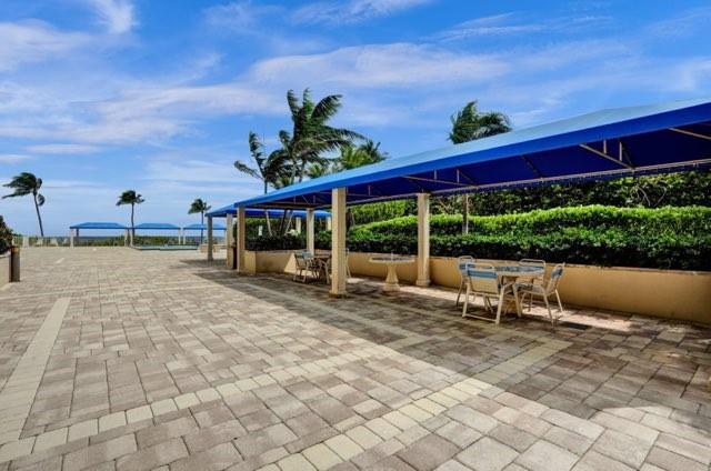 2000 South Ocean Boulevard, Unit 8F Lauderdale-by-the-Sea, FL 33062 - Photo 5 of 35 a view of a house with backyard and sitting area