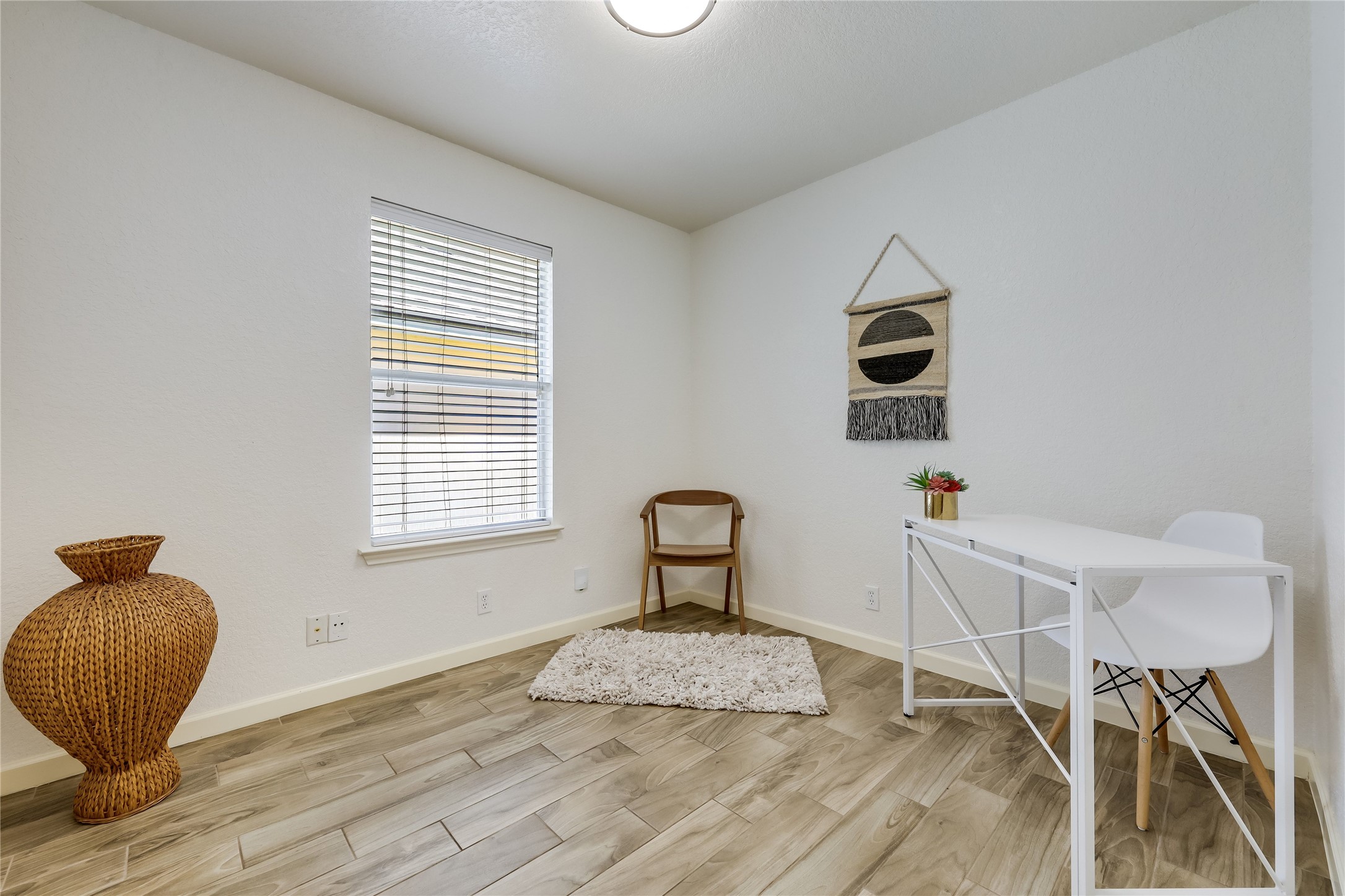 4510 Secure Lane Austin, TX 78725 - Photo 14 of 24 a bedroom with a bed and a window